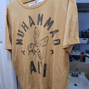 Roots of fight xl Muhammad Ali Bee symbol shirt